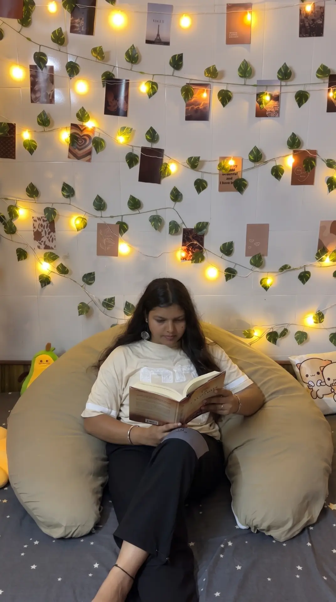 Woman reading a book supported by the Diwan Body Pillow